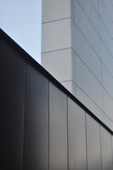Fototapeta premium Architectural shot of aluminium horizontal element against silver cladding
