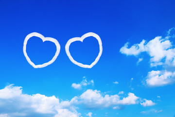couple white heart shaped clouds on blue sky