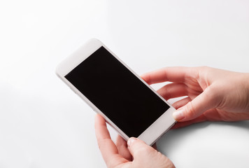 Hand holding and Touch on White Smartphone 