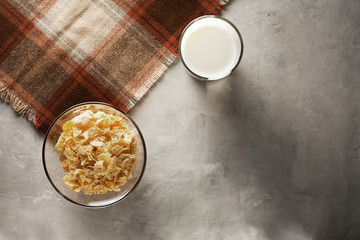Fresh muesli in a glass plate on the table with a napkin