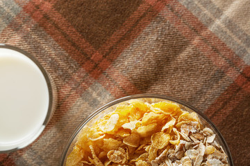 Fresh muesli in a glass plate on the table with a napkin