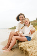 Fototapeta premium Happy family resting on a sandy beach