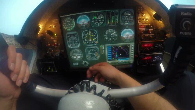 Pilot having problem with aircraft flight control system, hand knocking on panel