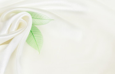 White silk background with flower drapery