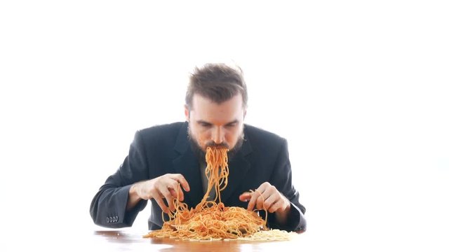 Dirty businessman eating pasta on the table. Nasty business and disgusting consumerism concept, studio isolated on white background.