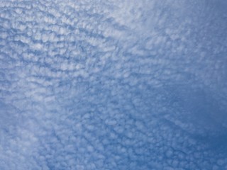 Blue sky seem like sand on the beach.