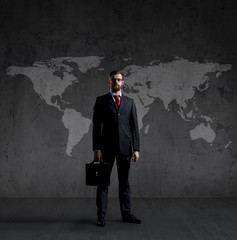 Businessman in suit and tie. Black background with copyspace. Bu
