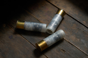 Hunting ammunition on wooden background.closeup