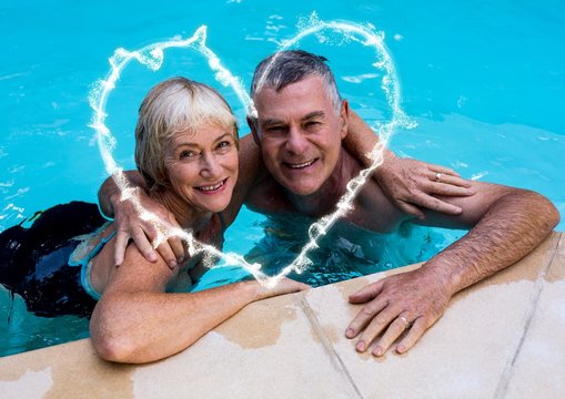 Portrait of couple with arm around in swimming pool