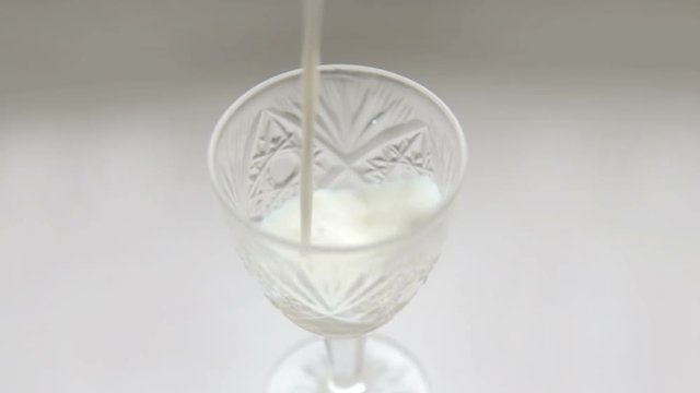 In a glass is poured milk