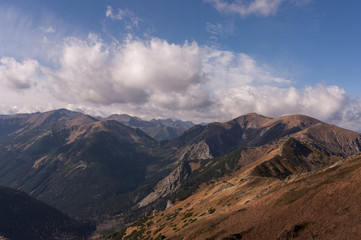 Panorama of autumnal mountains under the clouds