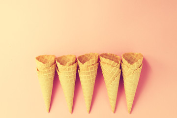 Empty Colorful Pastel Toning Ice Cream Cones on Pink Background.