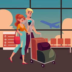 Man and woman travelling together, going on vacation, pushing luggage trolley in airport terminal interior with a view of airplane. Full length portrait of young couple, man and women in the airport