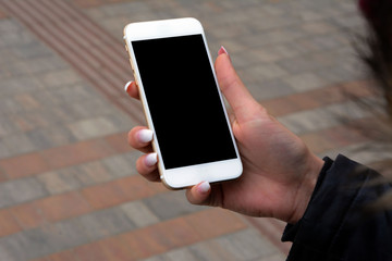 Young woman holding a cell phone
