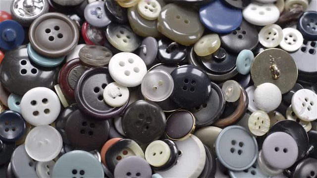 many buttons of different colors and shapes. Seamless looping
