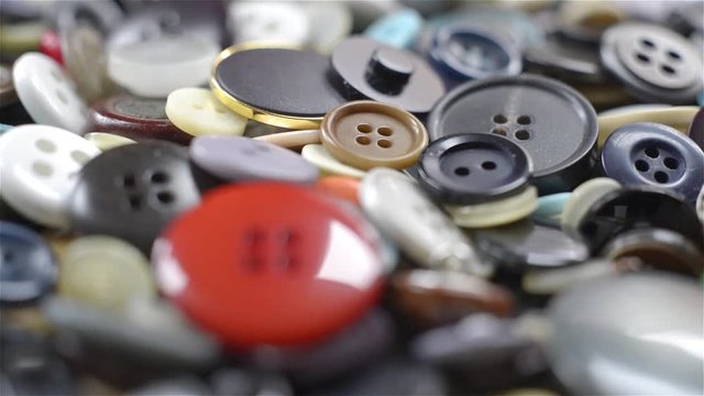 many buttons of different colors and shapes. Rack focus
