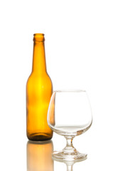Empty beer bottle and crystal glass,shot on white isolated.