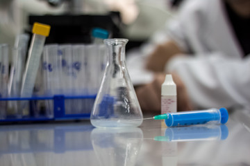 Modern scientist working in biotechnological laboratory equipmen