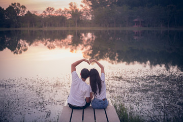 Couple in love holding hearts.