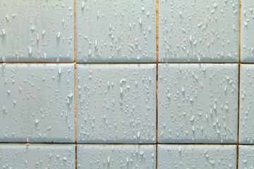 Water drop on ceramic tile wall  background