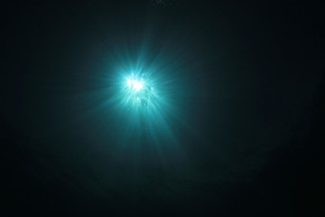 Underwater sunburst and ocean background photo