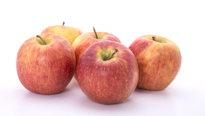 Five red apples on a white background