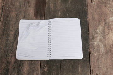 notebook crumpled paper wrinkled blank  white  on the desk, busi