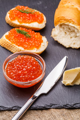 Bread with red roe, knife