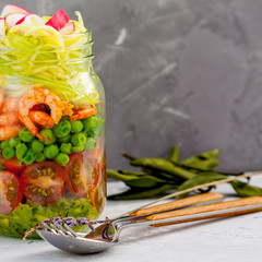 Zucchini pasta with shrimps and avocado in the jar. Love for a healthy food concept