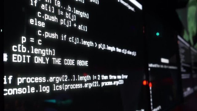 Program code on the screen, dark background, close-up.