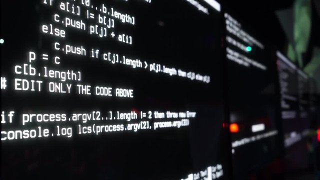 Program code on the screen, dark background, close-up.
