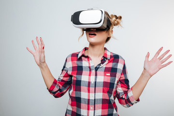 Woman in shirt using virtual reality device