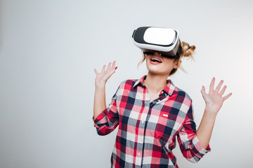 Happy Woman in shirt using virtual reality device