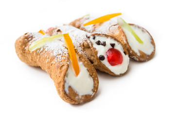 Sicilian cannoli, italian dessert with ricotta cheese, chocolate chips and candied fruit 