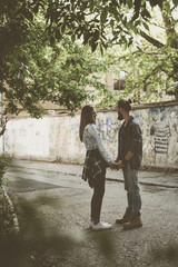 Fototapeta na wymiar Couple holding hands outdoors.