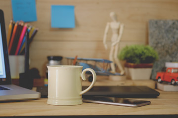 Coffee mug on work table.