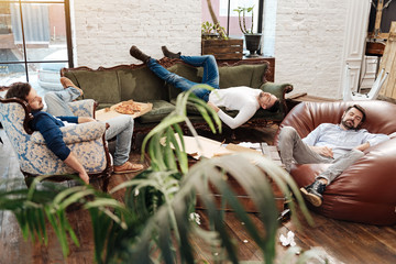 Handsome attractive men sleeping in the living room