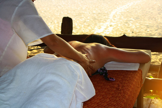 Skin And Body Care Beautiful woman enjoy together a massage at spa beach centre