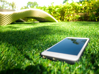 cellphone on a artificial grass field