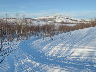 Fototapeta na wymiar The hills in the winter ,snow,blue sky.