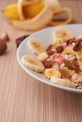 flakes with dried fruit, granola on the plate