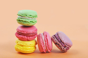 Different types of tasty and colorful macaroons isolated on the white background with copy space