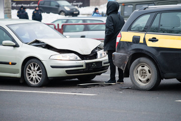 Fototapeta na wymiar Accident on the winter road, smashed car