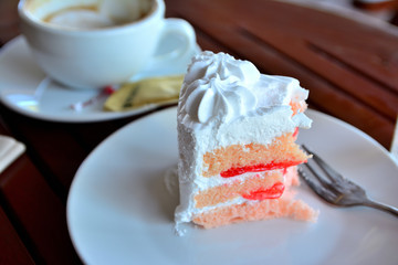 cake and cup of coffee on  wooden table