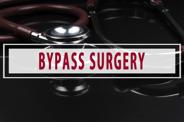 Stethoscope on black background with text BYPASS SURGERY