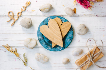 Two wooden hearts on blue plate - Valentine's day concept