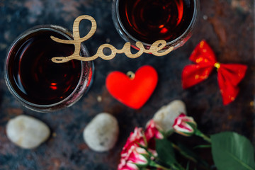 Beautiful letters LOVE on glasses of wine