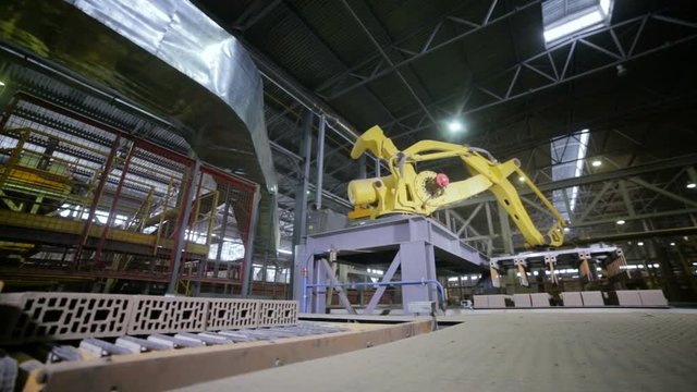 Industrial automation. Robotic Arm Assembling products. Timelapse HD