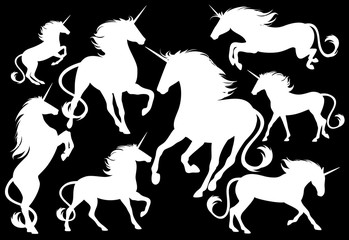 set of fine unicorn silhouettes - running, rearing and jumping magic horses