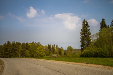 Fototapeta premium A beautiful norther Europe landscape with a road in late spring